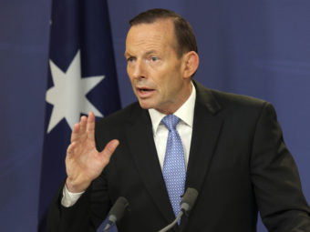 Australian Prime Minister Tony Abbott speaks during a news conference in Sydney last week. Abbott has announced the deployment of 190 police to help secure the MH17 wreckage site, where 37 Australians were killed. Rob Griffith/AP