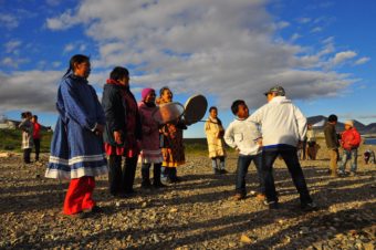 The residents of Novoye Chaplino greeted vistors when they arrived on the beach with traditional song and dance. (Photo by Emily Schwing/KUAC)