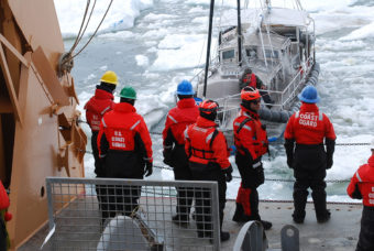 Coast Guard Cutter Healy crewmembers make contact with a mariner aboard his 36-foot sailboat trapped in Arctic ice approximately 40 miles northeast of Barrow, Alaska, July 12, 2014. Coast Guard 17th District watchstanders in Juneau were contacted by North Slope Borough Search and Rescue that a man, sailing his sailboat from Vancouver, Canada, to eastern Canada via the Northwest Passage, needed assistance after his vessel had become trapped in the ice. (Photo courtesy of Coast Guard Cutter Healy)