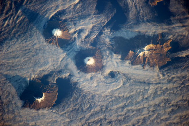 The Islands of the Four Mountains as seen from the International Space Station in 2013. Cleveland Volcano is at center. (Photo courtesy NASA)
