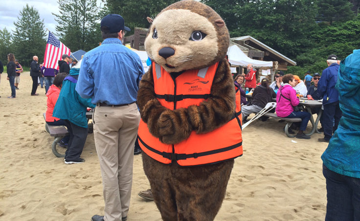 The PFD Otter teaches boat safety at the picnic. (Photo by Sarah Yu/KTOO)