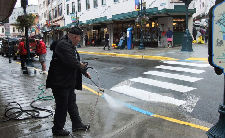 The effort included power washing the sidewalks and gutters. (Photo by Rosemarie Alexander)