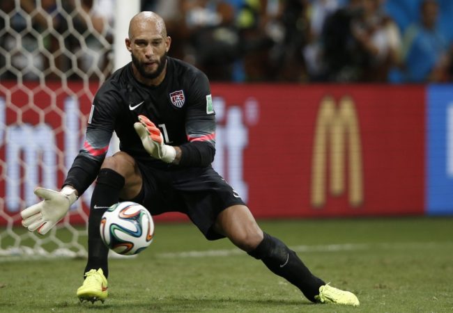 U.S. goalkeeper Tim Howard makes a save during extra time in the World Cup Round of 16 match with Belgium. Howard's record 16-save performance set off admiration and several Internet memes. Adrian Dennis/AFP/Getty Images
