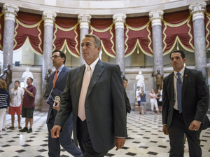 Speaker John Boehner makes his way to the House chamber on Wednesday. J. Scott Applewhite/AP