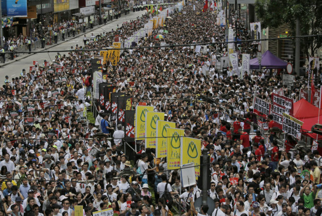 Tens of thousands of people march Tuesday in downtown Hong Kong during an annual protest pushing for greater autonomy. Vincent Yu/AP