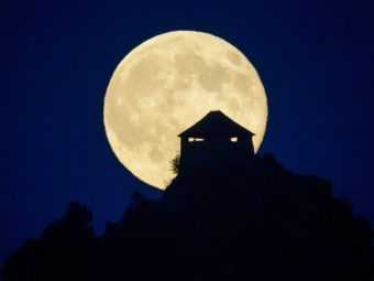 The full moon rises above the castle of Somoskoujfalu, northeast of Budapest, Hungary, earlier this month. Peter Komka/AP