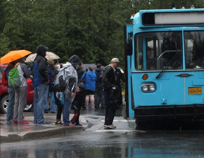 Tourists were often wearing rain gear and carrying umbrellas this month. (Photo by Matt Miller/KTOO)
