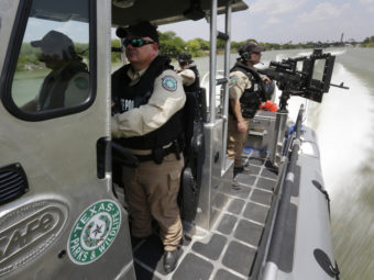 Texas Parks and Wildlife wardens patrol the Rio Grande on the U.S.-Mexico border in Mission, Texas, earlier this month. Eric Gay/AP