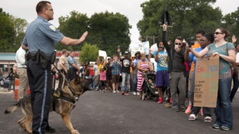 Protestors confront police during a rally to protest the shooting of Michael Brown, 18, by police in Ferguson, Mo. Brown died following a confrontation with police, according to St. Louis County Police Chief Jon Belmar. Sid Hastings/AP