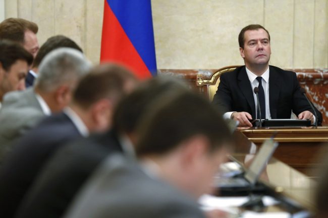 Russian Premier Dmitry Medvedev, right, heads the Cabinet meeting in Moscow on Thursday. Dmitry Astakhov/AP