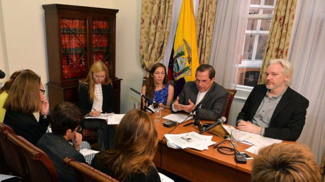 WikiLeaks founder Julian Assange (right) said he'll leave the Ecuadorian Embassy in London, at a news conference with Ecuador's Foreign Minister Ricardo Patino. Assange has been holed up at the embassy for two years. John Stillwell/AFP/Getty Images