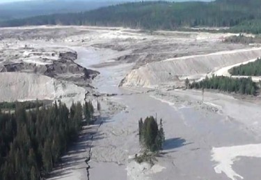 This aerial image from a British Columbia emergency office video shows the Mount Polley dam breaks and some of the damage downstream.