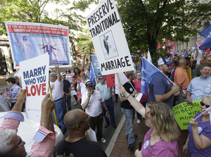 Supporters and opponents of gay marriage demonstrate outside the federal appeals court in Richmond, Va., in May. Steve Helber/AP