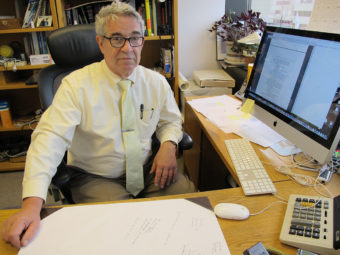 Dr. Oliver Korshin in his office in east Anchorage. (Photo by Annie Feidt/APRN)