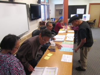 Voters at the Lower Kuskokwim School District choosing primary election ballots on Tuesday, August 19th, 2014. (Photo by Daysha Eaton/KYUK)