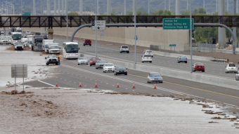 Flash-flood waters from the overrun Skunk Creek flood I-10 in northwestern Phoenix. Flooding from heavy rain forced authorities to close several major roads, including a portion of Interstate 17. Matt York/AP