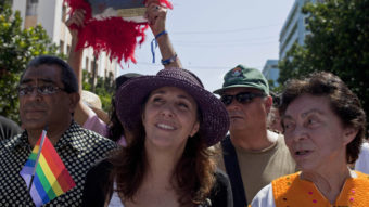 In what could be a first, Mariela Castro (center), daughter of Cuban President Raul Castro, voted against legislation in the country's parliament. In May, she marched in a parade for the International Day Against Homophobia in Havana. Franklin Reyes/AP