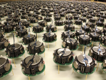 These 1024 "kilobots" can shuffle into any shape their creator desires. Each robot is a little bigger than a quarter, standing on three little metal legs that vibrate to make it move. Courtesy of Michael Rubenstein