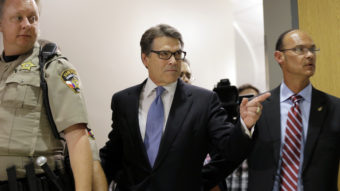 Texas Gov. Rick Perry arrives at the Blackwell Thurman Criminal Justice Center on Tuesday in Austin, Texas. Eric Gay/AP