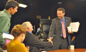 Joe Miller shakes hands with Mead Treadwell after Alaska Public Media’s statewide debate Wednesday night. Miller and Treadwell are vying for the GOP US Senate nomination. The third major candidate, Dan Sullivan, did not take part. (Photo by Patrick Yack/Alaska Public Media)