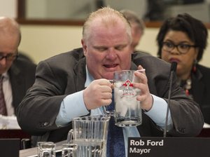 Toronto Mayor Rob Ford, seen here in December 2013, announced Friday that he was withdrawing his re-election bid to seek treatment for an abdominal tumor. Chris Young/The Canadian Press