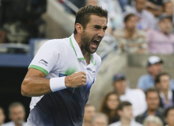 Marin Cilic of Croatia reacts after a shot against Kei Nishikori of Japan during the championship match of the 2014 U.S. Open tennis tournament. Cilic won in three sets. Mike Groll/AP