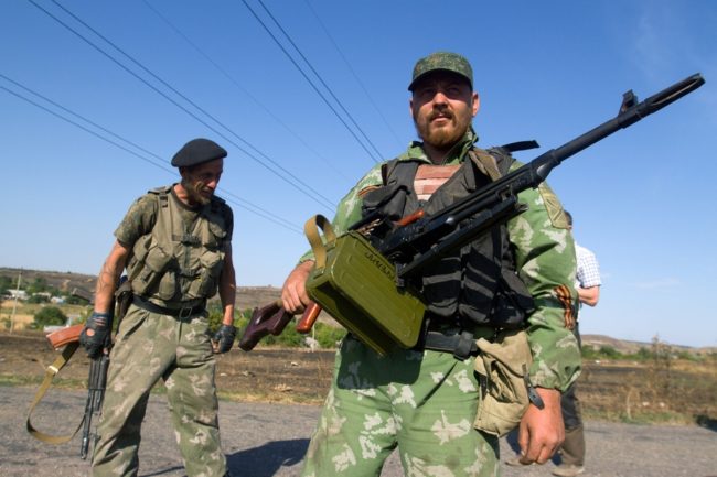 Pro-Russian separatists stand on a road in the village of Novokaterinovka, eastern Ukraine, on Thursday. Anatolii Boiko /AFP/Getty Images