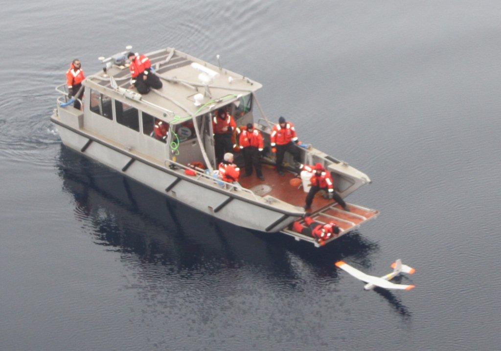 HEALY small boat crew retrieve a PUMA UAV using the Arctic Survey Boat (Courtesy photo USCG LCDR Kennedy and BMCM Sullivan)