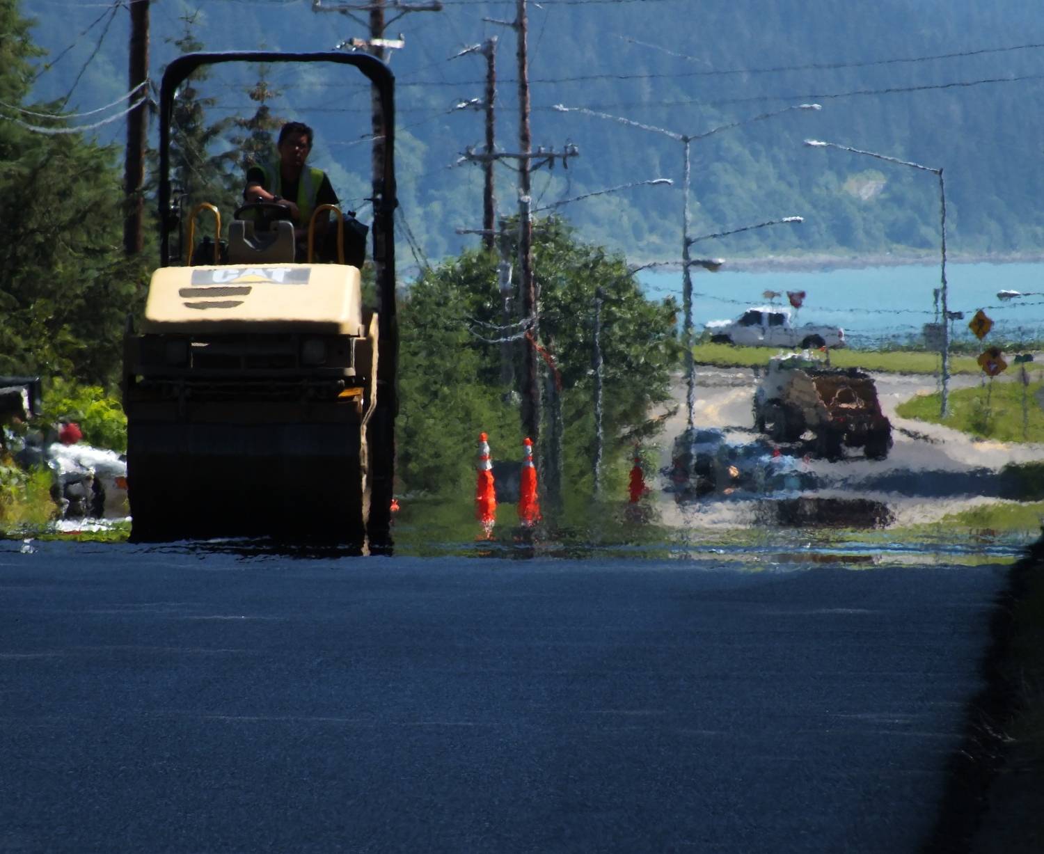 An hour after it was laid down, hot asphalt continues releasing heat. (Photo by Matt Miller/KTOO)