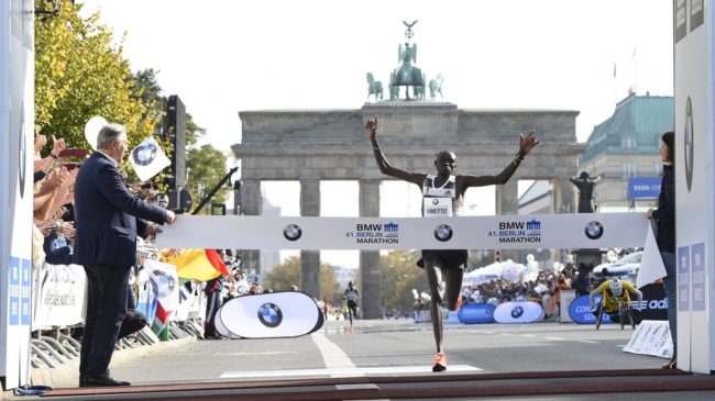 Kenya's Dennis Kimetto crosses the finish line to win the Berlin Marathon Sunday. Kimetto set a new world marathon record, breaking the 2 hour, 3 minute mark for the first time. Tobias Schwarz/AFP/Getty Images