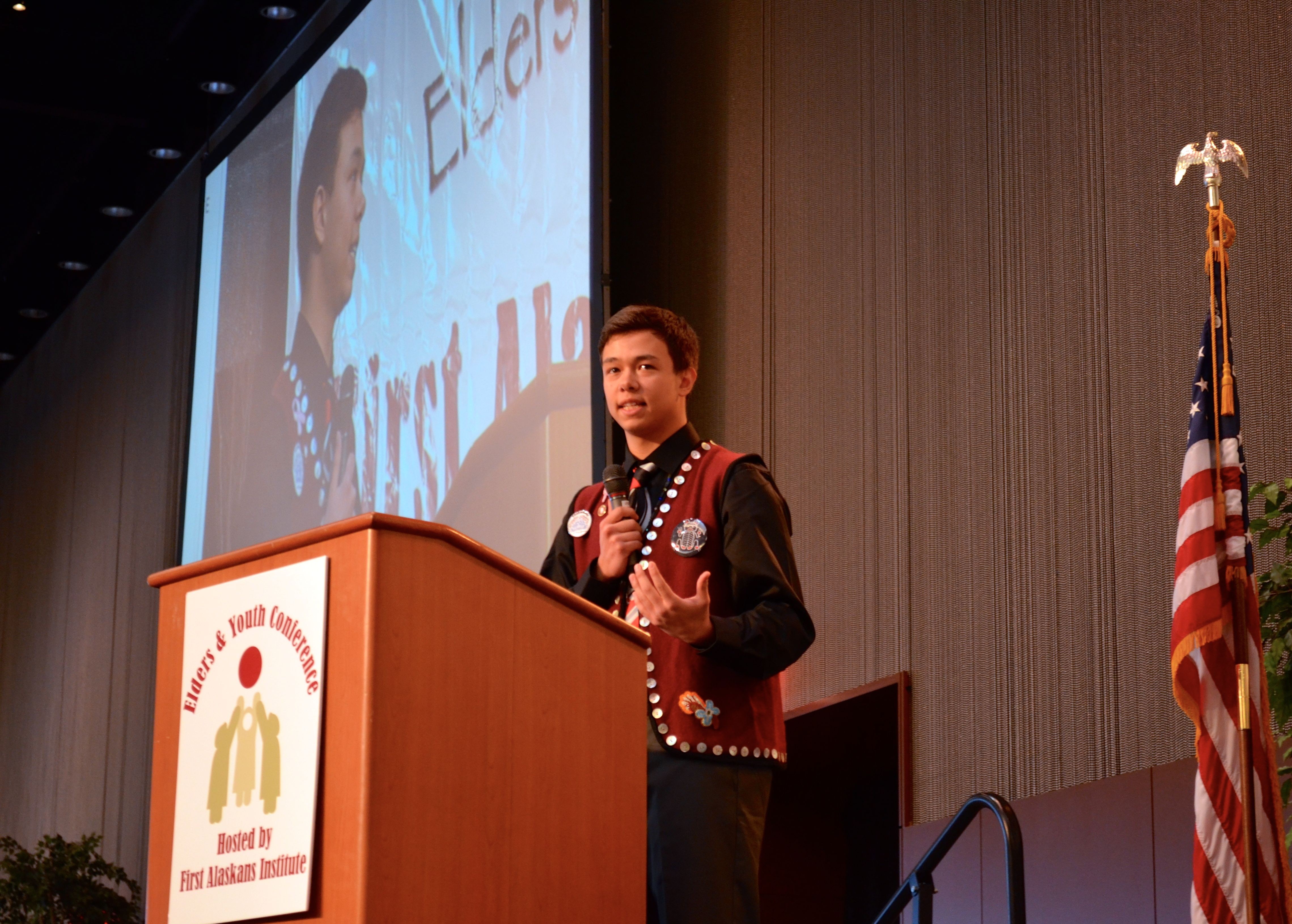 Devlin Anderstrom gives the youth keynote speech on the first day of Elders and Youth Conference 2014. (Photo by Jennifer Canfield/KTOO)