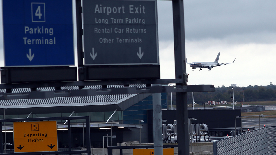 A plane arrives at New York's John F. Kennedy International Airport. Since Ebola screenings began Saturday, none of the 91 passengers identified as having an increased risk of an Ebola infection was found to be sick, the CDC says. Spencer Platt/Getty Images