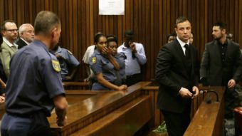 South African track star Oscar Pistorius is sentenced to five years in prison Tuesday for the fatal shooting of his girlfriend. (Themba Hadebe/AFP/Getty Images)