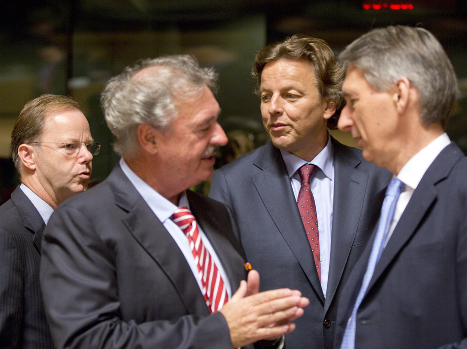 Dutch Foreign Minister Bert Koenders, center, speaks with Luxembourg's Foreign Minister Jean Asselborn, second left, and British Foreign Minister Philip Hammond, right, during a round table meeting of EU foreign ministers in Luxembourg on Monday. The ministers hope to raise 1 billion euros to fight Ebola. (Virginia Mayo/AP)