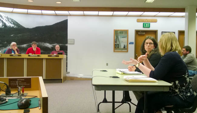 Michele Elfers listens as Wastewater Utility Superintendent Samantha Stoughtenger describes options for processing and disposing of biosolids at a Juneau Assembly Committee of the Whole meeting Monday. (Photo by Jeremy Hsieh/KTOO)