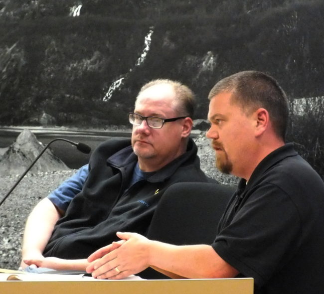 Planning Commission Chairman Mike Satre, right, questions Community Development Department staff while Commissioner Bill Peters listens during the Oct. 14, 2014 meeting on a Haven House conditional use permit. (Photo by Matt Miller/KTOO)