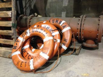 Extra ferry life rings lean against other spare parts at the Ketchikan Marine Engineering Facility at Ward Cove last January. (Photo by Ed Schoenfeld/CoastAlaska News)