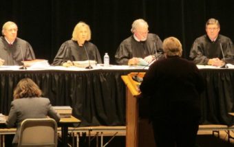 The Alaska Supreme Court listens to state attorney Mary Lundquist during the Supreme Court live event. (Photo by Leila Kheiry/KRBD)