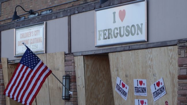 A local business is boarded up in anticipation of another night of unrest in Ferguson, Mo., Tuesday. A day after people set fire to buildings in the city, President Obama said, "I have no sympathy at all for destroying your own communities." Michael B. Thomas/AFP/Getty Images