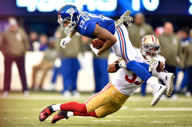 Eric Reid of the San Francisco 49ers tackles Odell Beckham of the New York Giants in the fourth quarter of Sunday's game at MetLife Stadium in East Rutherford, N.J. Al Bello/Getty Images