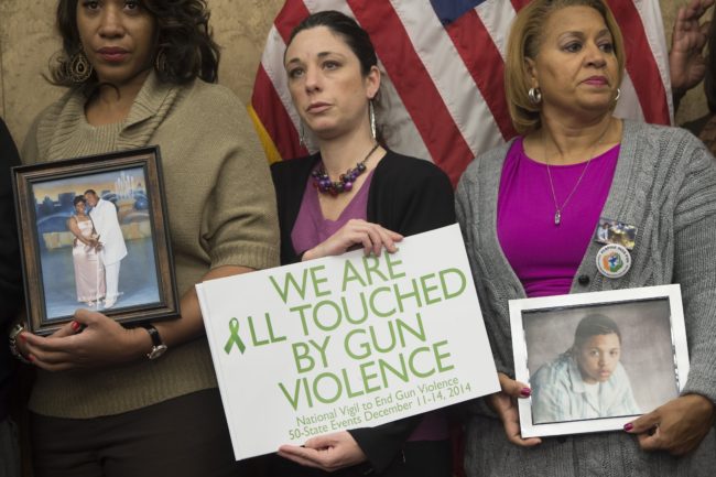 Relatives of victims of gun violence attend a press conference honoring the second anniversary of the Sandy Hook Elementary School shootings in Washington, D.C. on Dec. 10, 20. Saul Loeb/AFP/Getty Images 