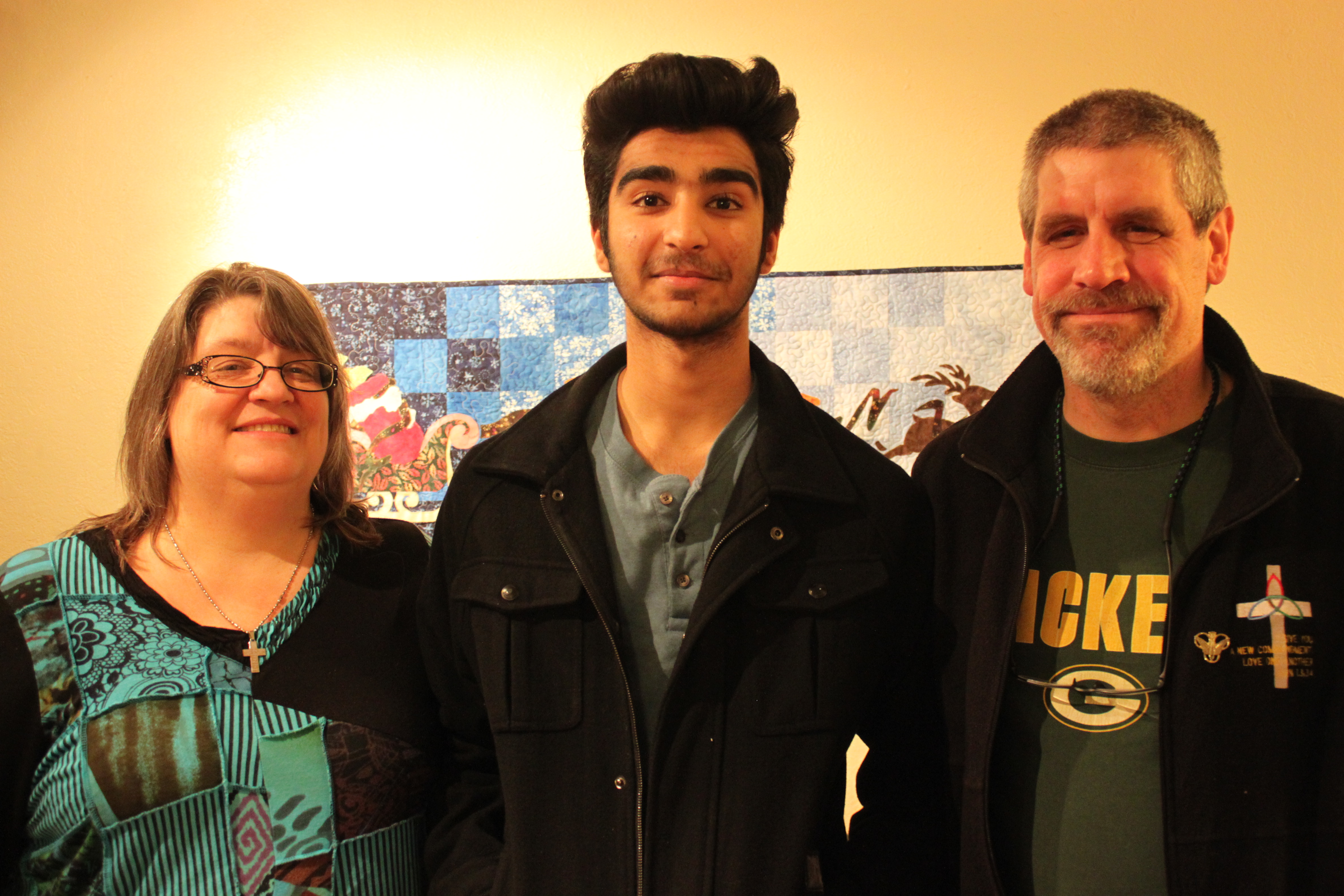 Hassam with his host parents, Valerie Ringle and Dave Ringle. (Photo by Lisa Phu/KTOO)