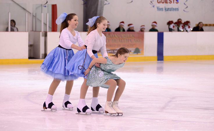Grace Wallie leads Sadie Murphy and Katie McKenna in the finale skated to Rockin’ Around the Christmas Tree.
