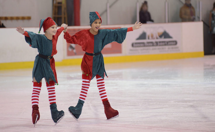 Tessa Murphy and Dominique Murphy dance to Rudolph the Red Nose Reindeer during the Juneau Skating Club’s holiday recital at Treadwell Ice Arena.