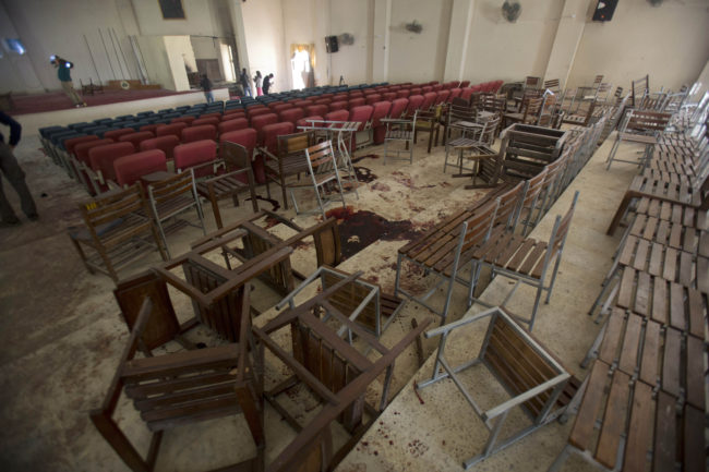 Chairs are upturned and blood stains the floor at the Army Public School auditorium the day after Taliban gunmen stormed the school in Peshawar, Pakistan. B.K. Bangash/AP