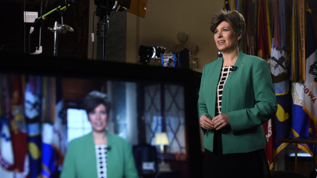 Sen. Joni Ernst, R-Iowa, rehearses her remarks for the Republican response to President Obama's State of the Union address on Tuesday. Susan Walsh/AP