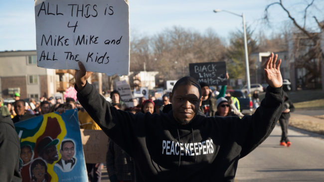 Demonstrators remember Michael Brown on Martin Luther King Jr. Day, marching from the apartment complex where Brown was killed to the Ferguson police station. A federal inquiry has found no evidence that officer Darren Wilson violated Brown's civil rights, sources tell NPR. Scott Olson/Getty Images