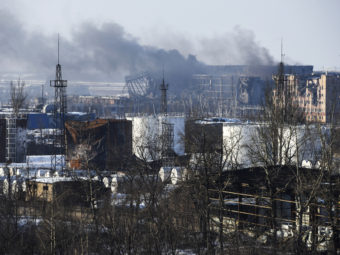 Smoke rises over the new terminal of Donetsk airport in Donetsk, Eastern Ukraine, where government troops have launched an offensive to capture the area from Russian-backed separatists. Mstyslav Chernov/AP