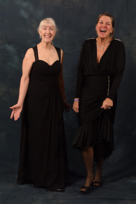 Valerie Delaune and Jennifer Thompson. Delaune bought her floor length chiffon dress from Anderson's Bride. She plans to wear it for the inaugural ball in Anchorage as well. Thompson borrowed her ensemble from friend Delaune. (Photo by Skip Gray/KTOO)