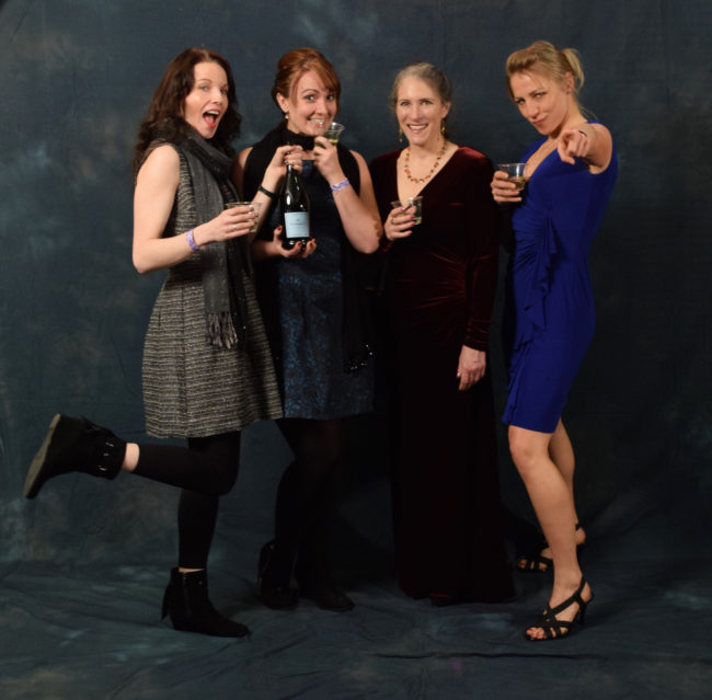 Lindsey Bray, Marisha Bourgeois, Kathy Coghill and Adrienne Antoni are coworkers at Bartlett Regional Hospital. They had a pre-party to get dressed up, drink wine and snack on smoked salmon.  (Photo by Skip Gray/KTOO)